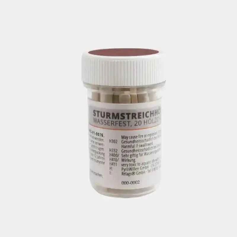 Tarro de cerillas impermeables Origin Outdoors con tapa blanca y texto de uso